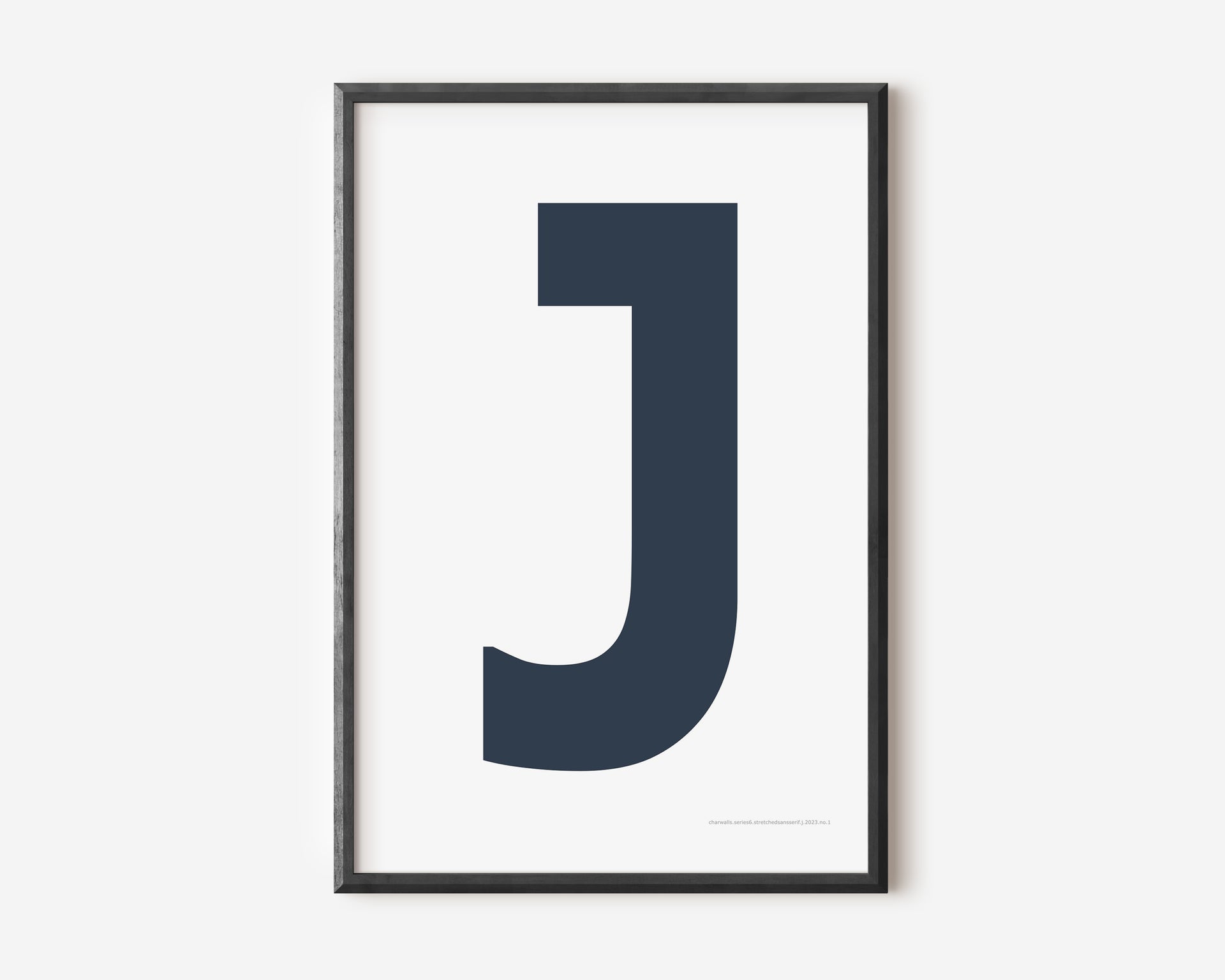 Letter J art print with navy blue J and white background.