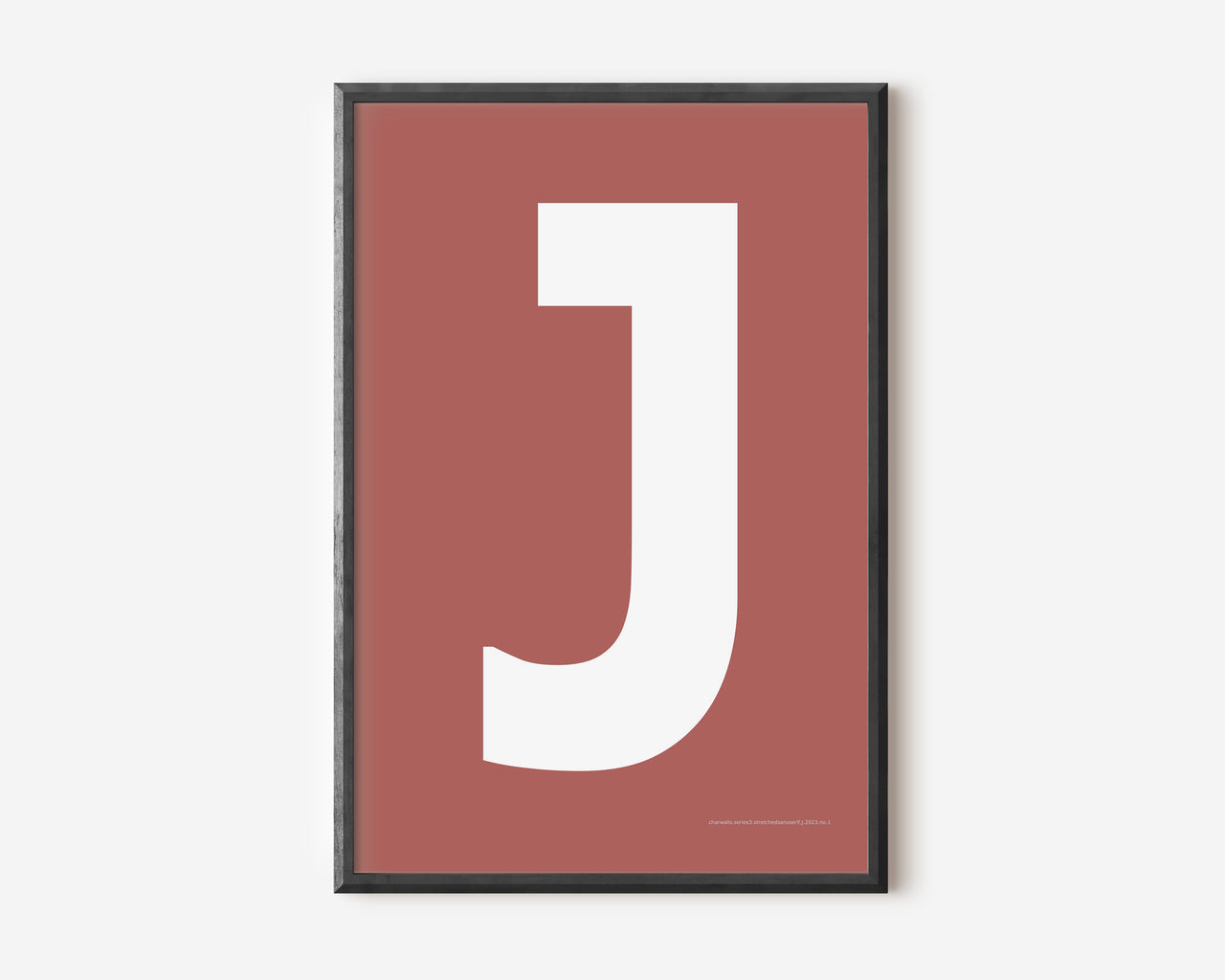 Modern art print with an uppercase white letter J on a Nantucket red background.