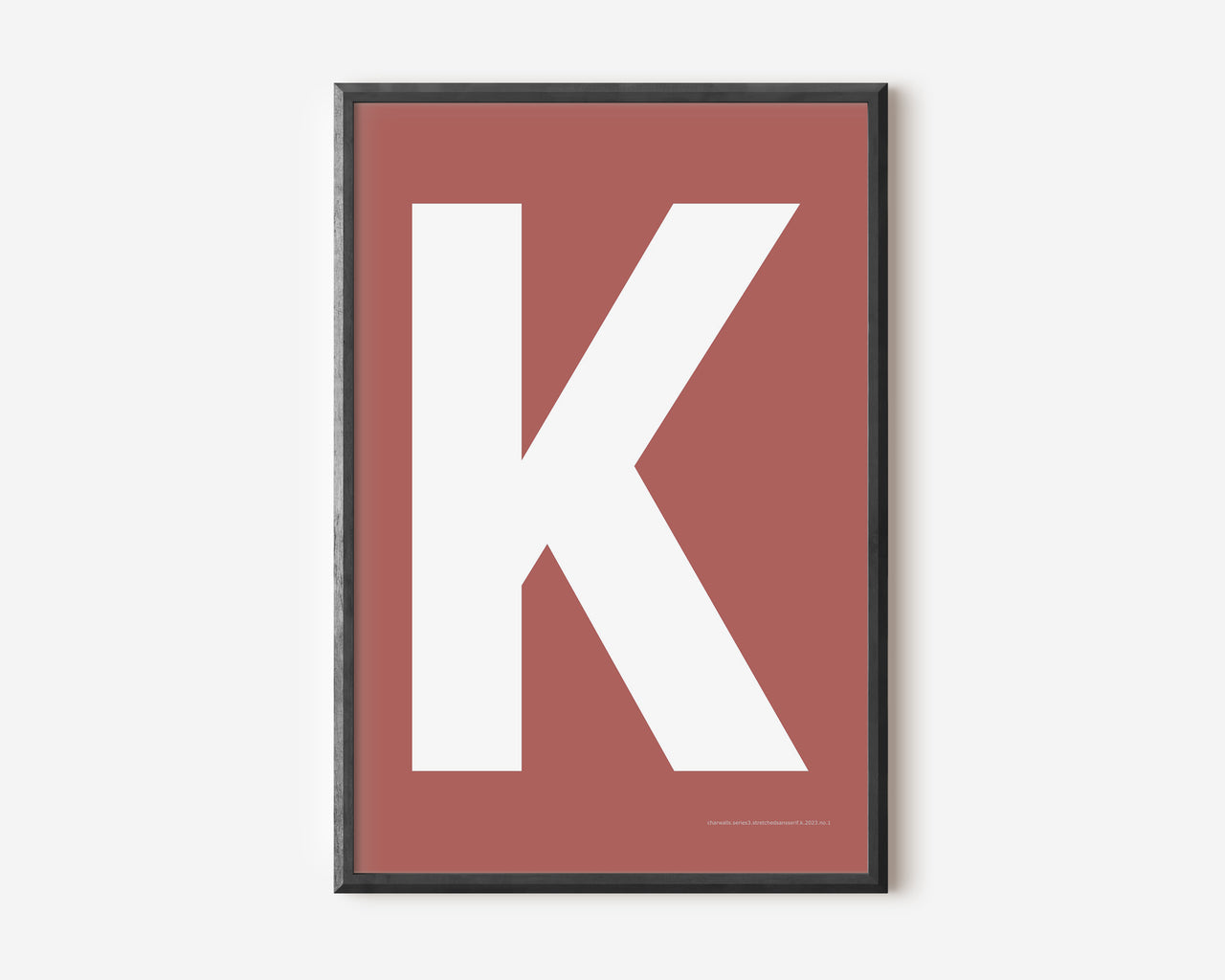 Modern art print with an uppercase white letter K on a Nantucket red background.