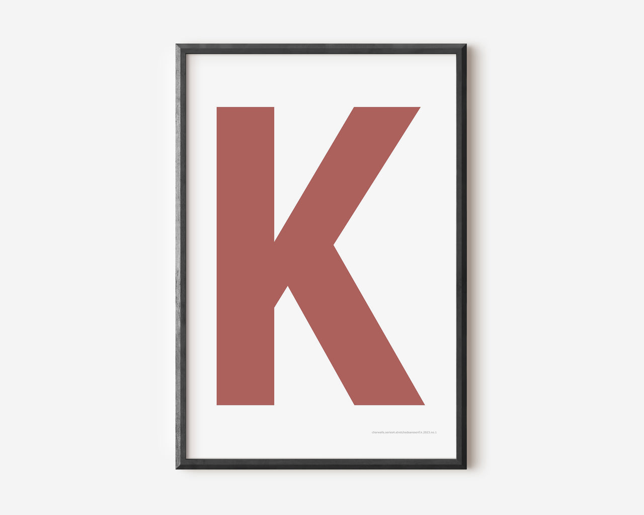 Modern art print with an uppercase Nantucket red letter K on a white background.