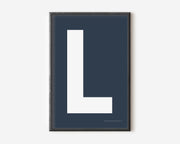 Modern art print with an uppercase white letter L on a navy blue background.
