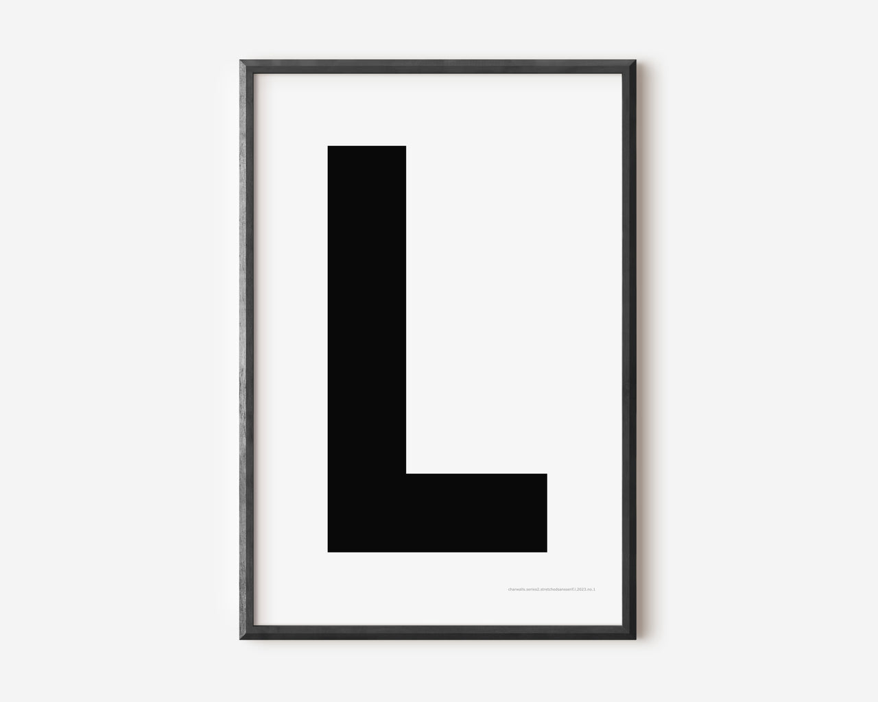 Modern art print with an uppercase black letter L on a white background.