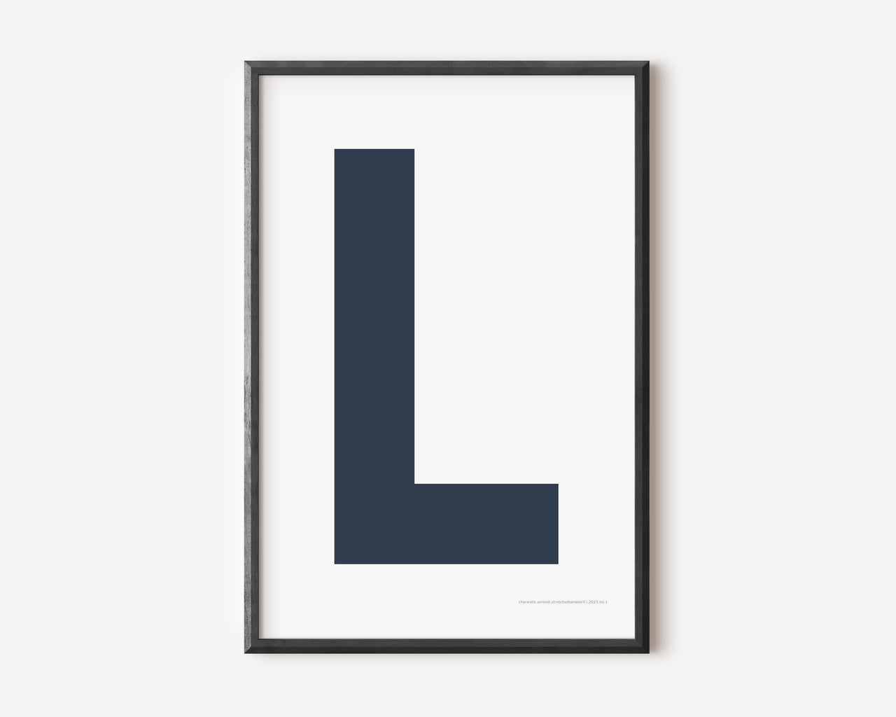 Modern art print with an uppercase navy blue letter L on a white background.