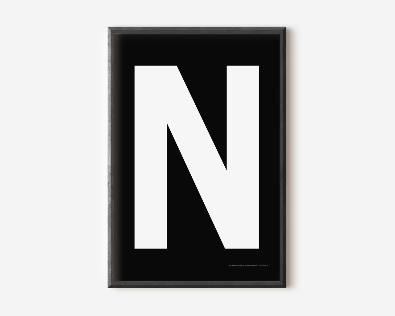 Modern art print with an uppercase white letter N on a black background.