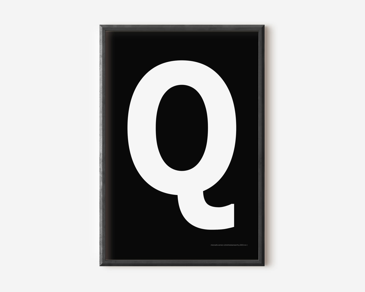 Modern art print with an uppercase white letter Q on a black background.