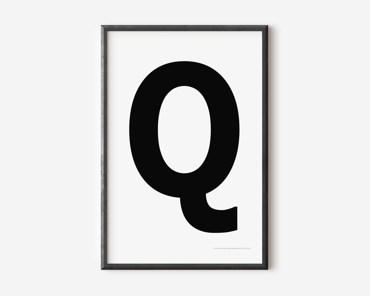 Modern art print with an uppercase black letter Q on a white background.