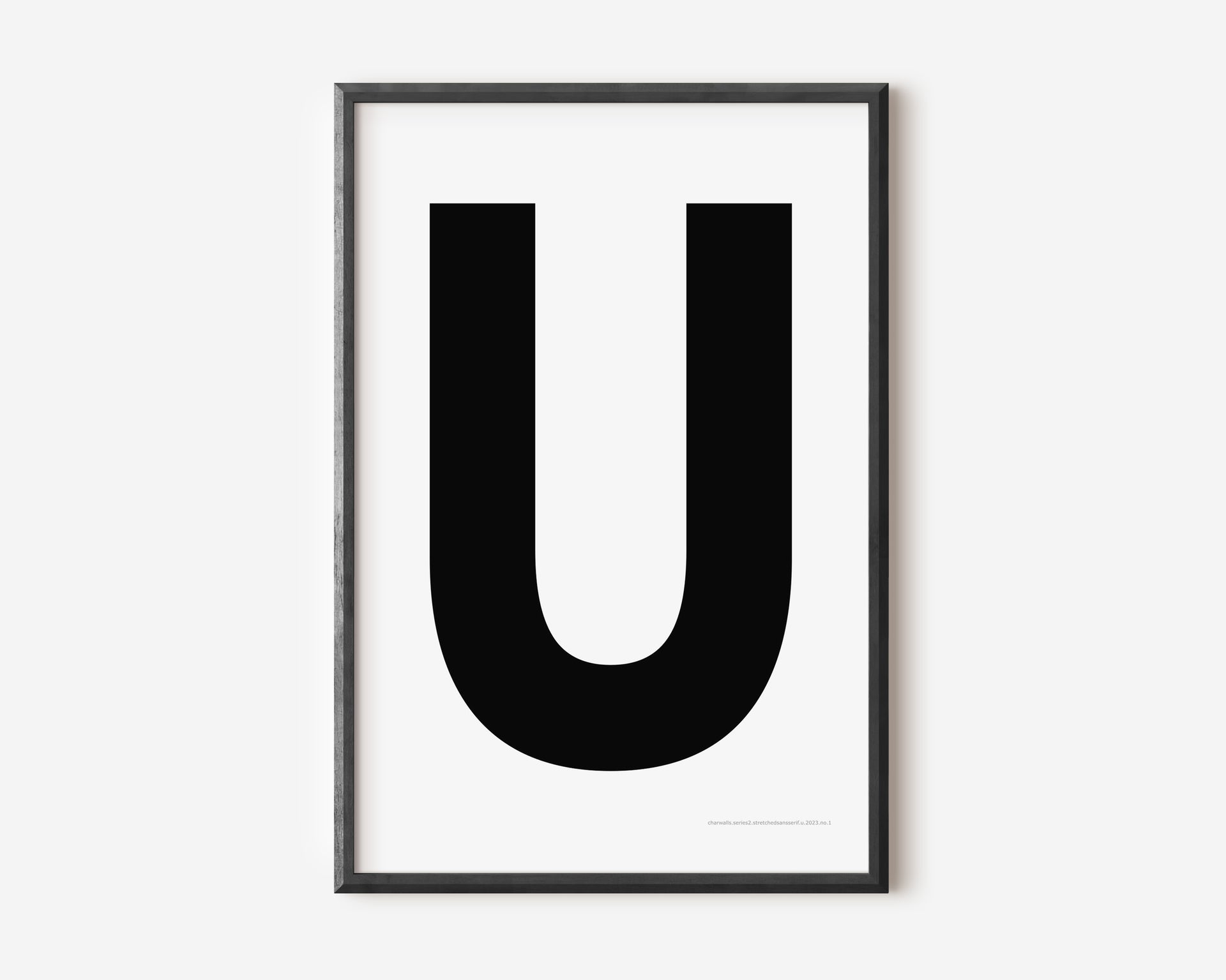 Modern art print with an uppercase black letter U on a white background.