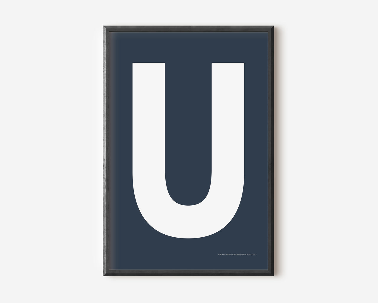 Modern art print with an uppercase white letter U on a navy blue background.
