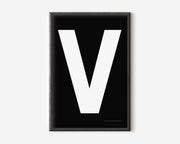 Modern art print with an uppercase white letter V on a black background.