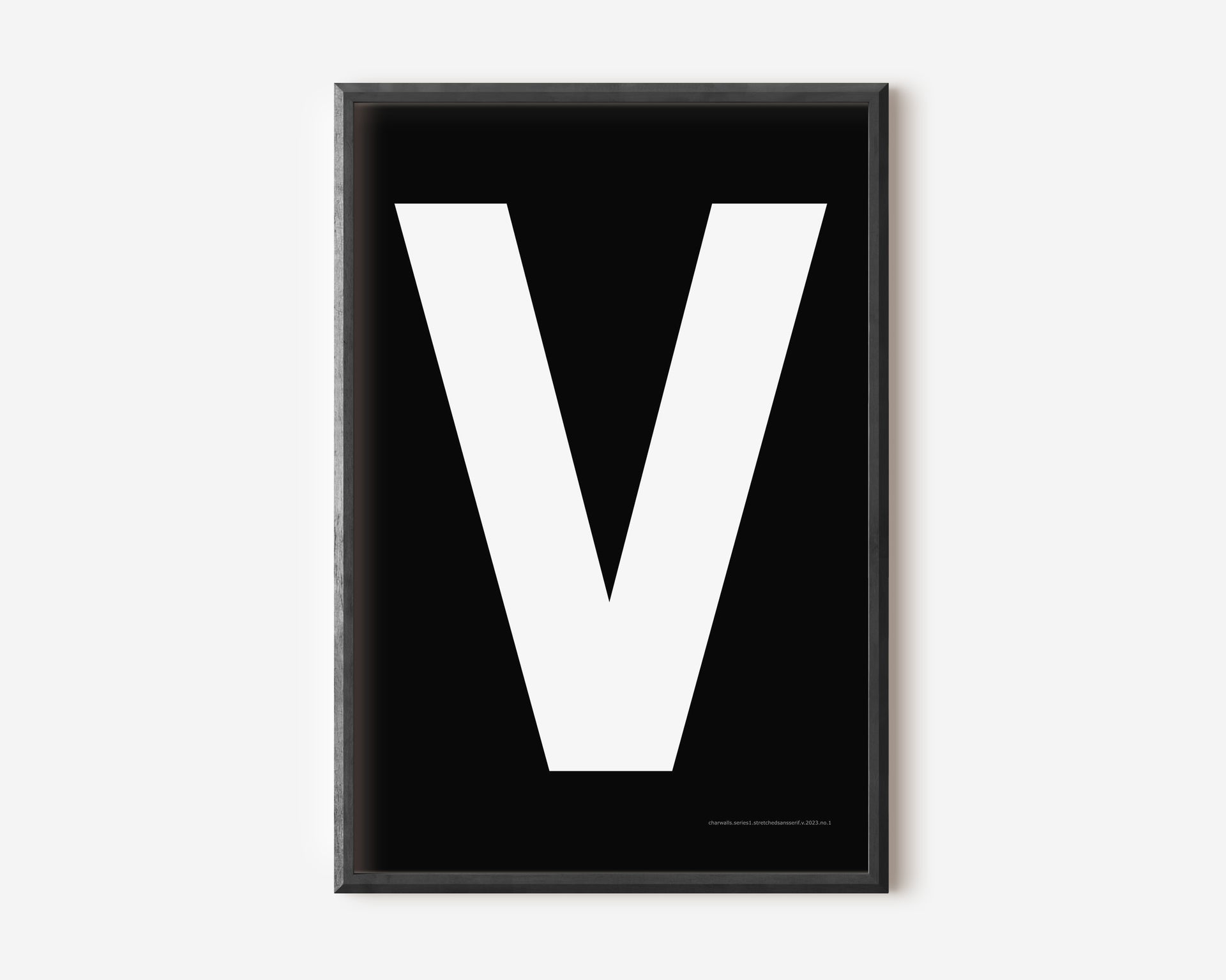 Modern art print with an uppercase white letter V on a black background.