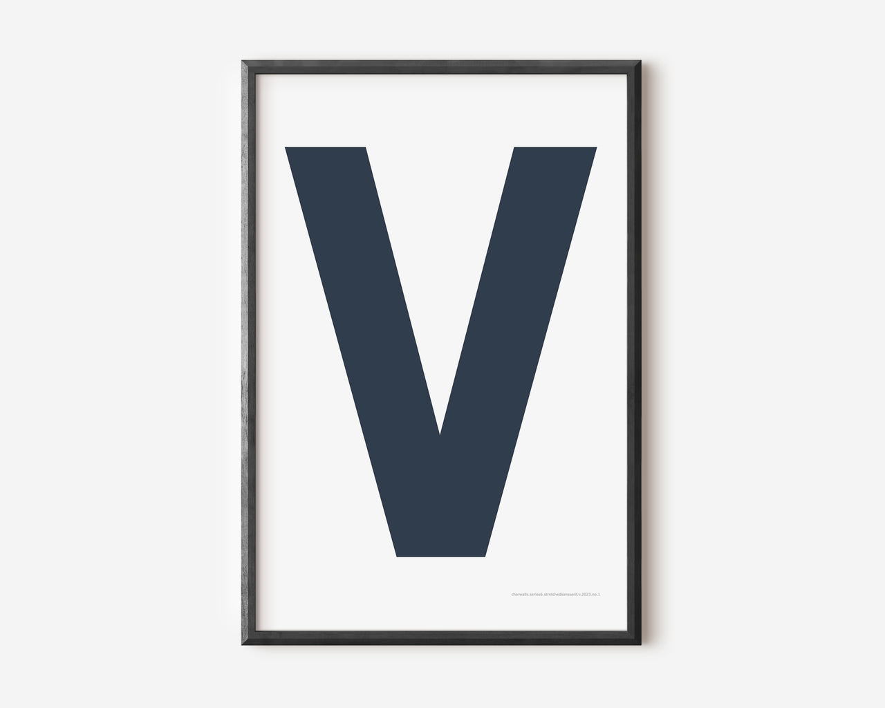 Modern art print with an uppercase navy blue letter V on a white background.