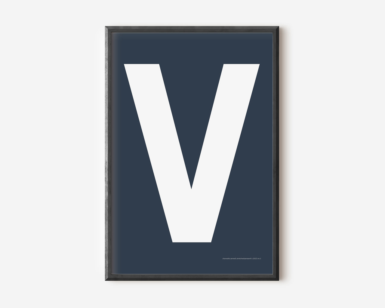 Modern art print with an uppercase white letter V on a navy blue background.