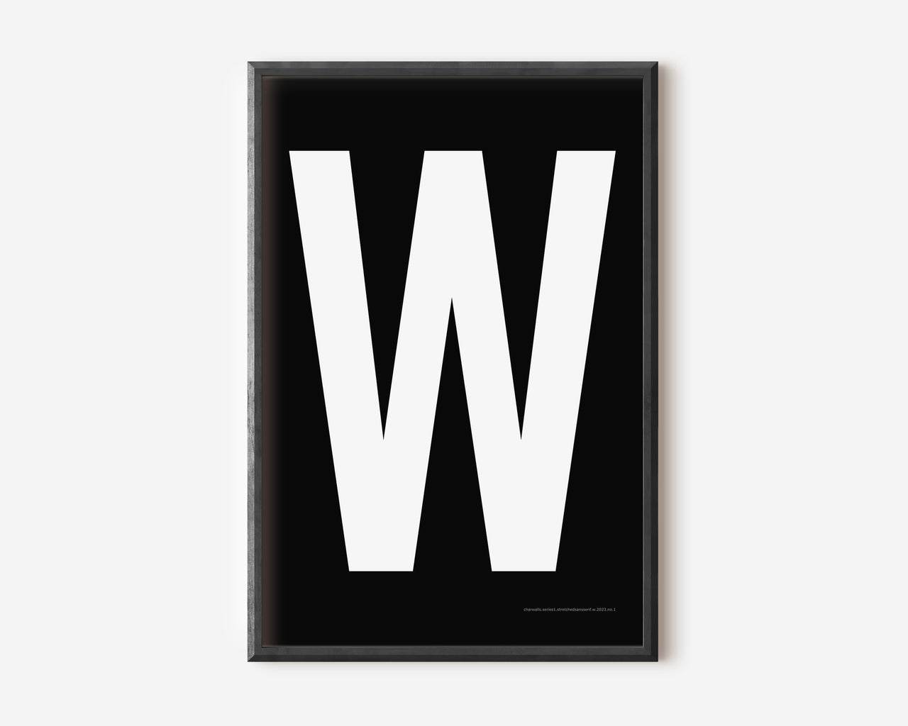 Modern art print with an uppercase white letter W on a black background.