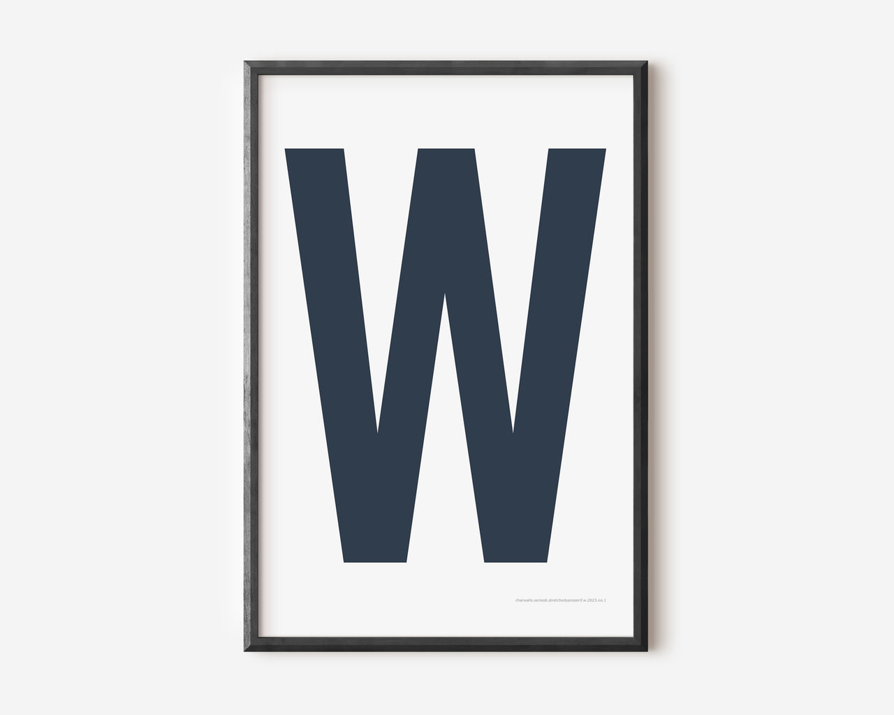 Modern art print with an uppercase navy blue letter W on a white background.