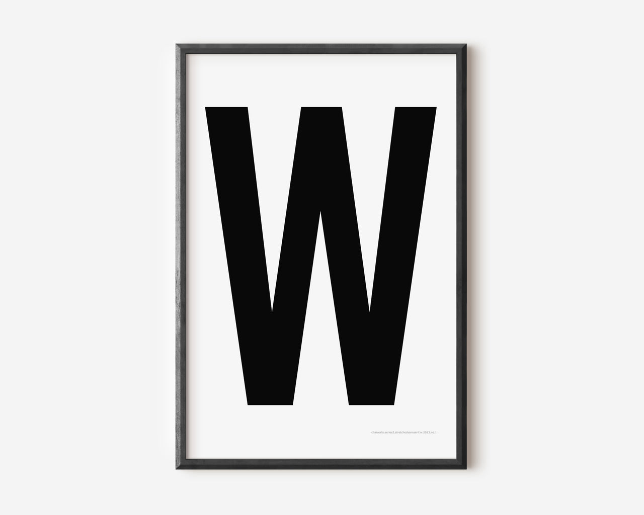 Modern art print with an uppercase black letter W on a white background.