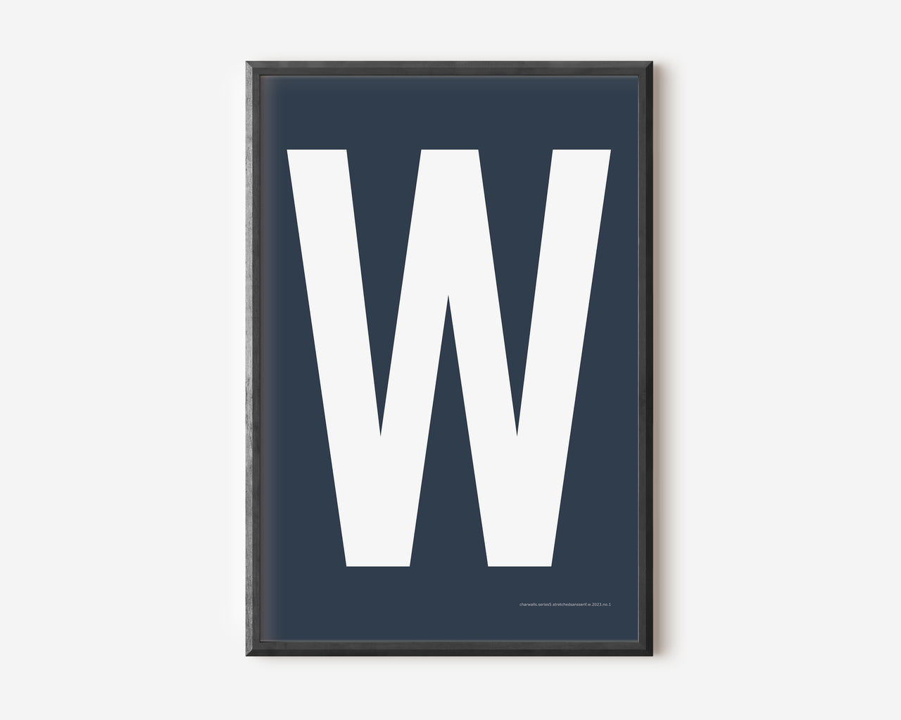 Modern art print with an uppercase white letter W on a navy blue background.