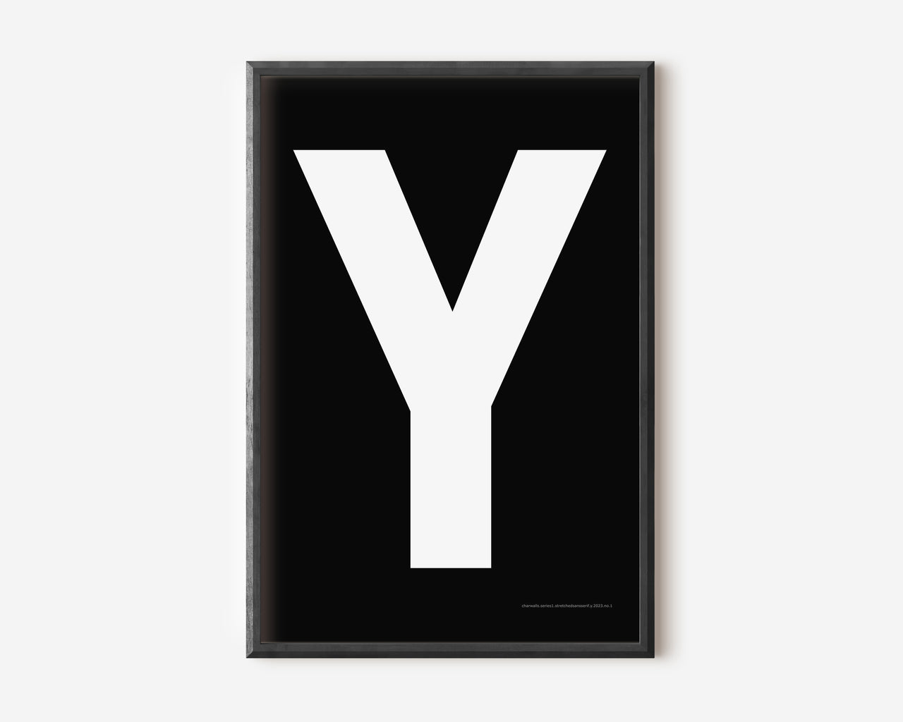 Modern art print with an uppercase white letter Y on a black background.
