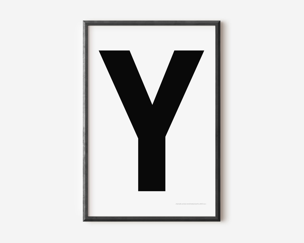 Modern art print with an uppercase black letter Y on a white background.