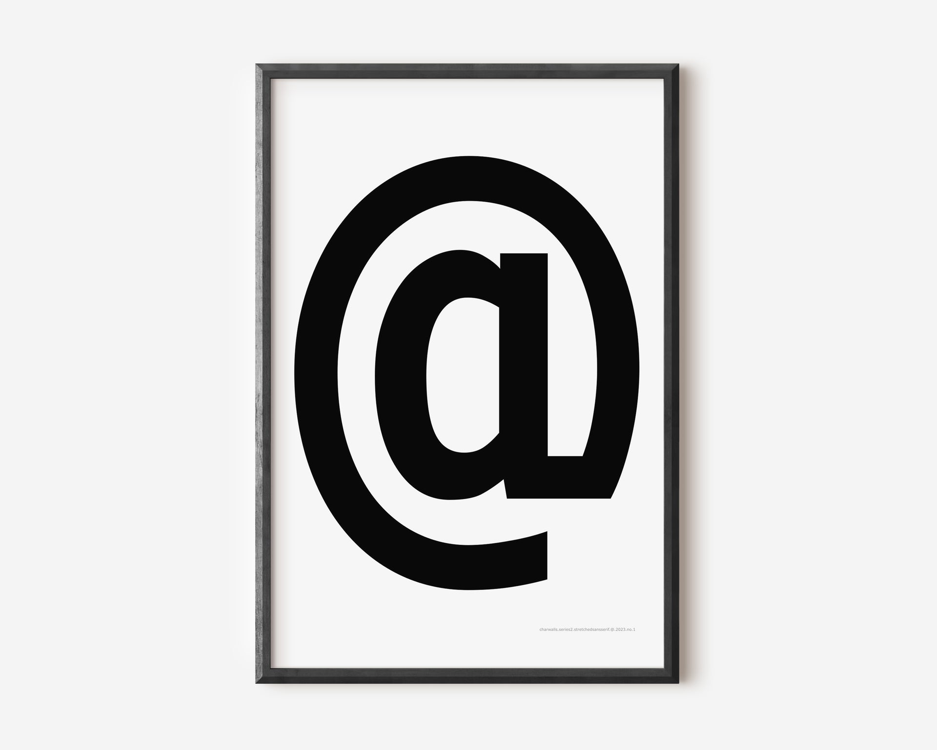 Modern symbol art print with a black at sign on a white background.