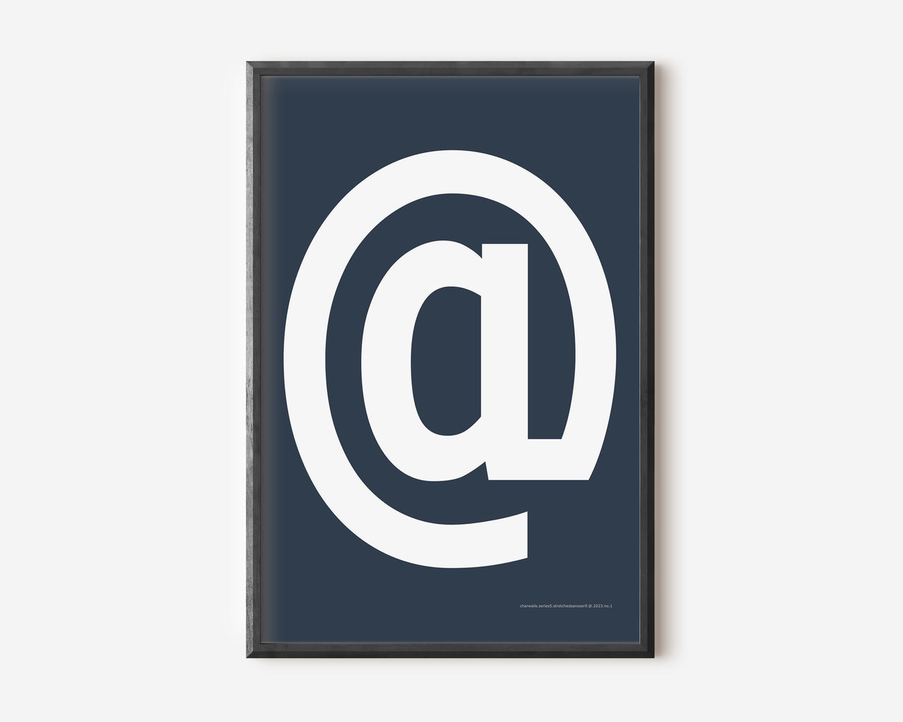 Modern symbol art print with a white at sign on a navy blue background.