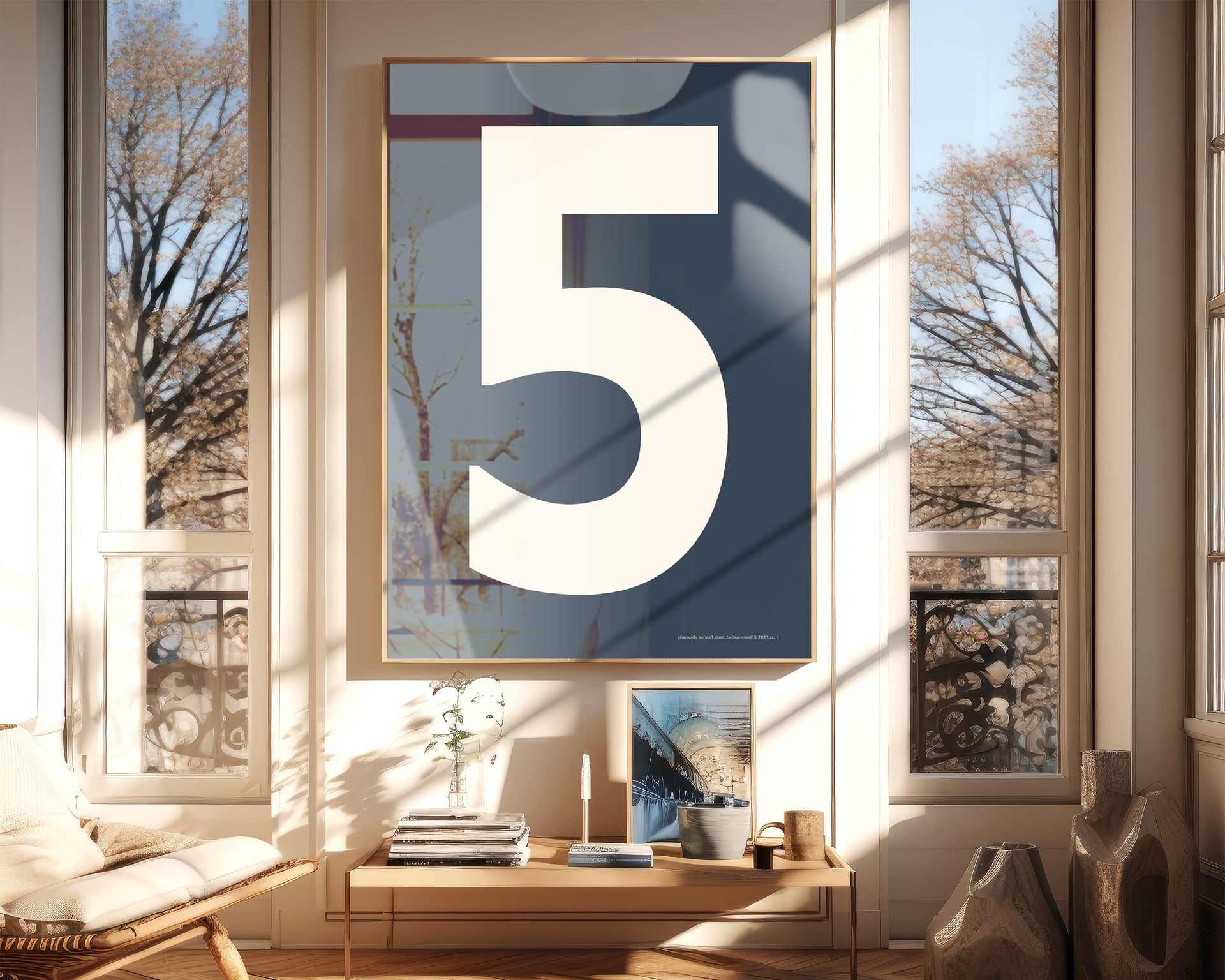 Oversized framed navy blue and white number art print featuring the number 5 in a modern living room.