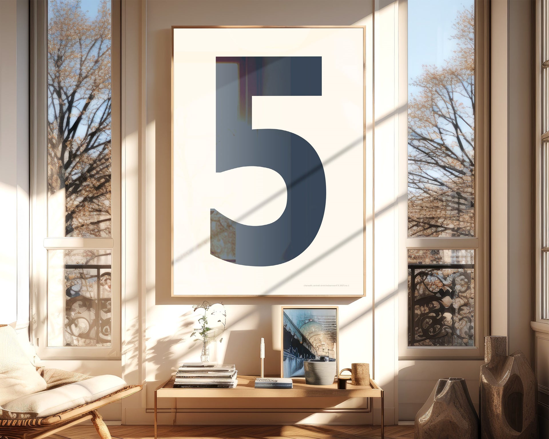 Oversized framed navy blue and white number art print featuring the number 5 in a modern living room.