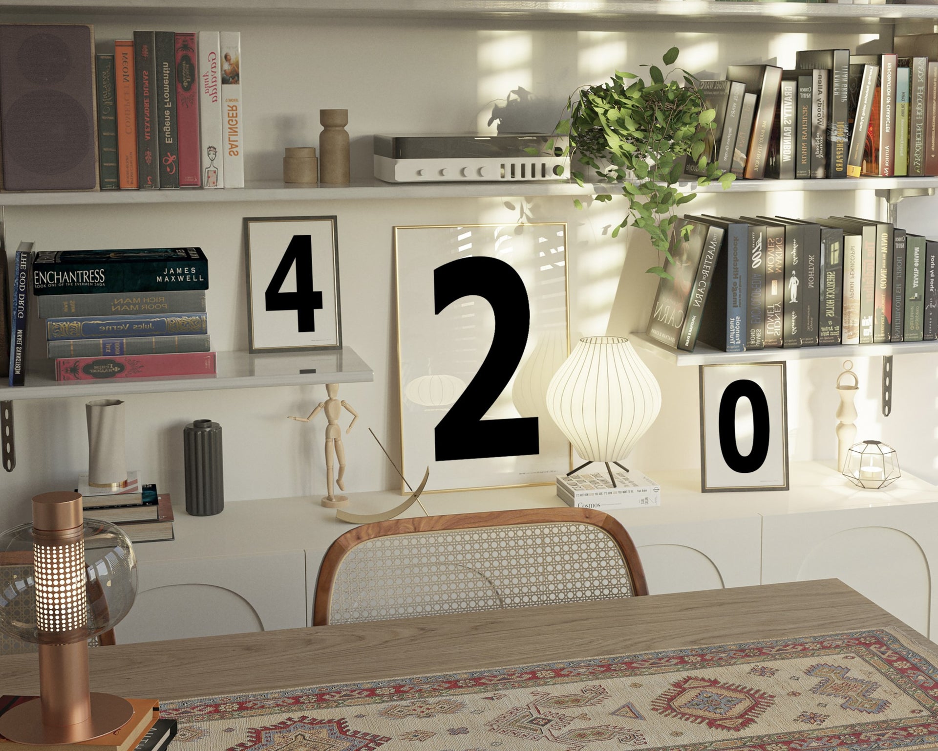 Three black and white framed number art prints spelling out 420 on an eclectic and modern bookshelf.