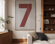 Oversized framed Nantucket red and white number art print featuring the number 7 in a modern living room.