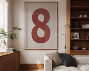 Oversized framed Nantucket red and white number art print featuring the number 8 in a modern living room.